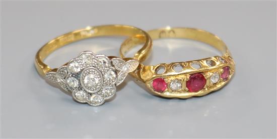 Two early 20th century 18ct gold and gem set ring including diamond cluster.